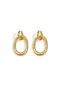 Statement oorbellen met gedetailleerde ovale hanger